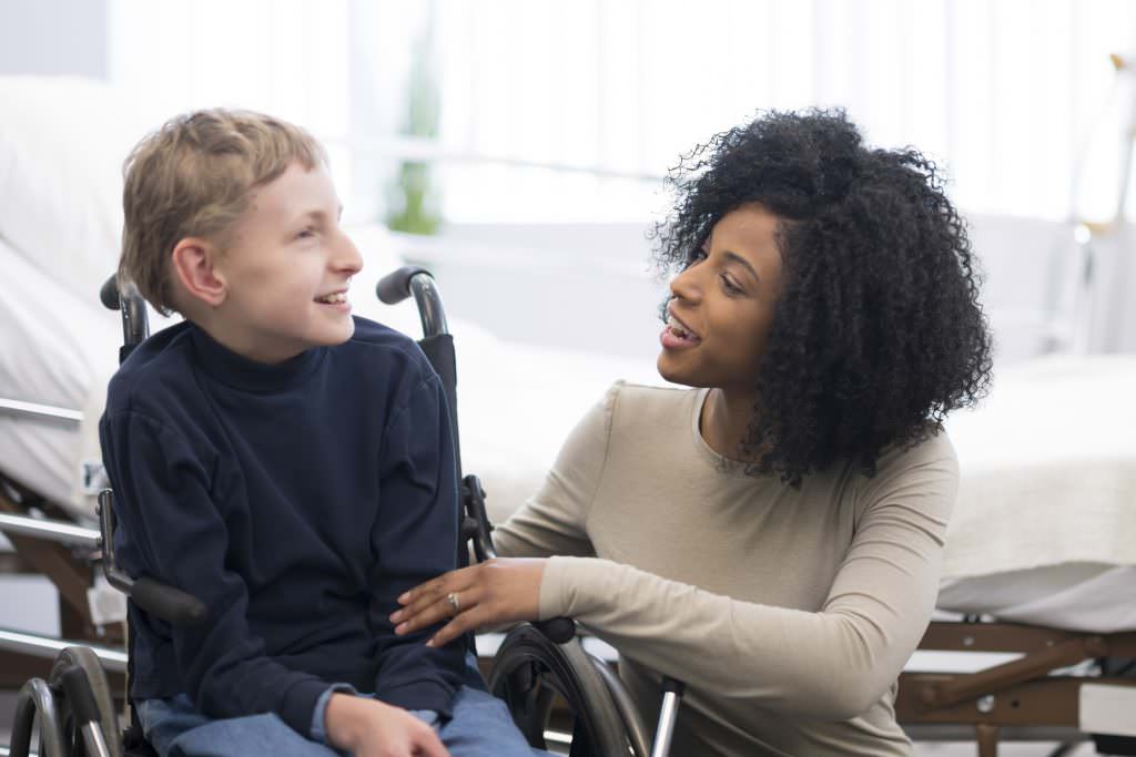 Happy Child with Cerebral Palsy & physiotherapist